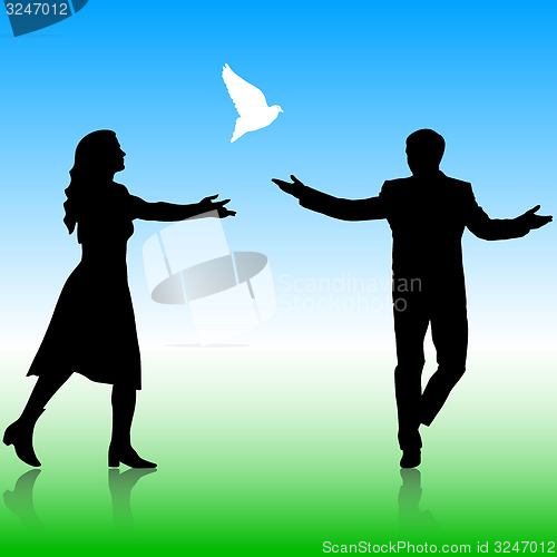 Image of Silhouettes girl and guy released doves into the sky. 