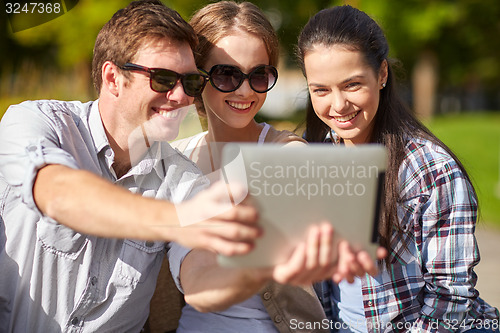Image of students or teenagers with tablet pc taking selfie