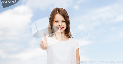 Image of smiling little girl in white blank t-shirt