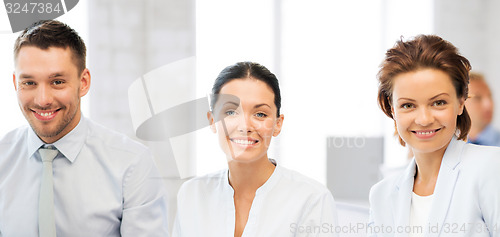 Image of business team discussing something in office