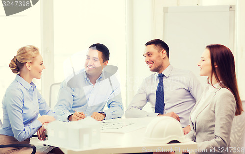 Image of happy team of architects and designers in office