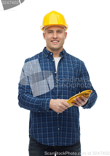 Image of smiling man in helmet with gloves