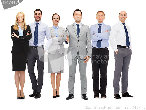 Image of group of smiling businessmen making handshake