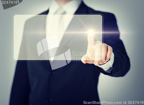 Image of male hand touching virtual screen