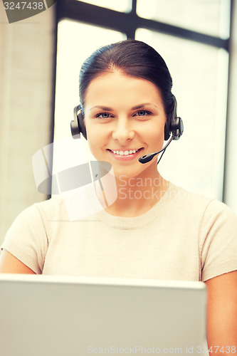 Image of helpline operator with laptop computer