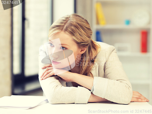 Image of unhappy woman in office