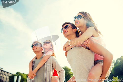 Image of smiling couple having fun in city