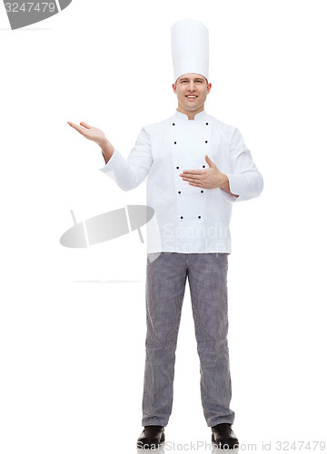 Image of happy male chef cook inviting