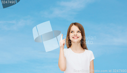 Image of smiling little girl in white blank t-shirt