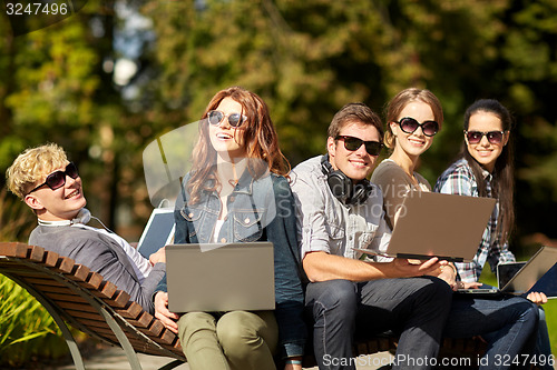 Image of students or teenagers with laptop computers