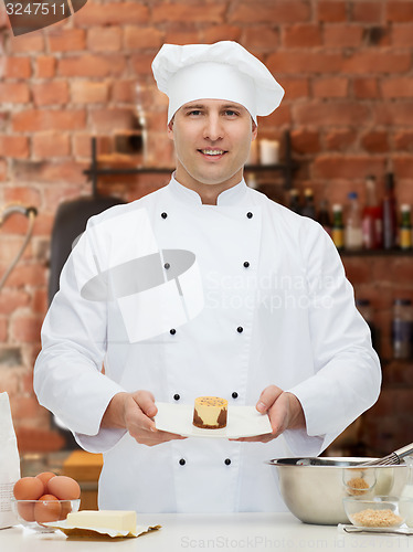 Image of happy male chef cook baking