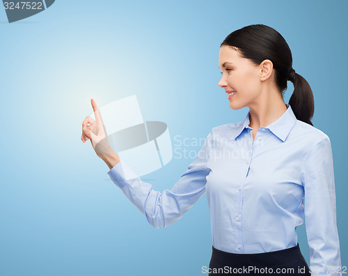 Image of businesswoman touching something imaginary