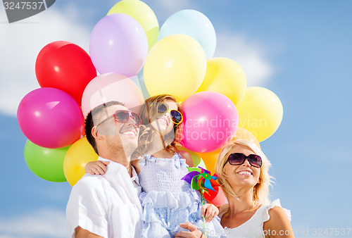 Image of family with colorful balloons