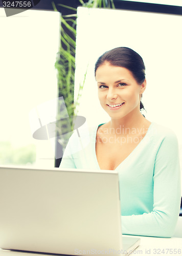 Image of happy woman with laptop computer