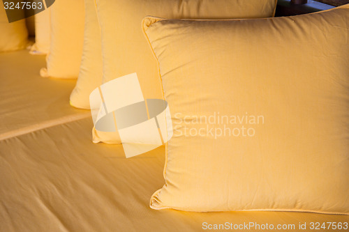 Image of couch with pillows at hotel