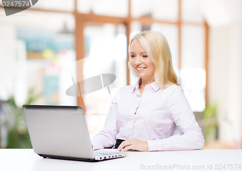 Image of smiling businesswoman or student with laptop