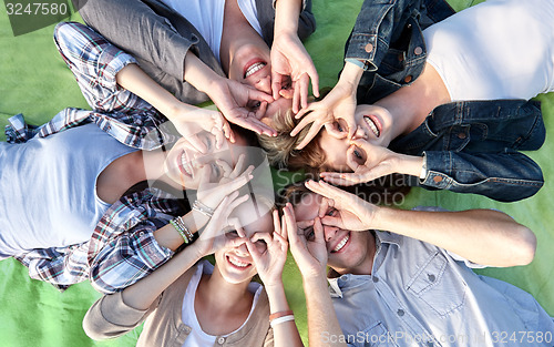 Image of group of students or teenagers lying in circle