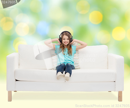 Image of happy girl in headphones listening to music
