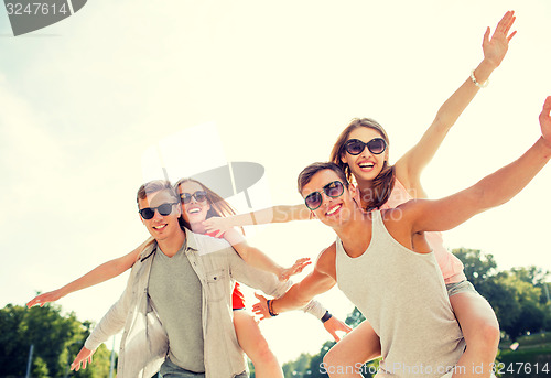 Image of smiling couple having fun in city