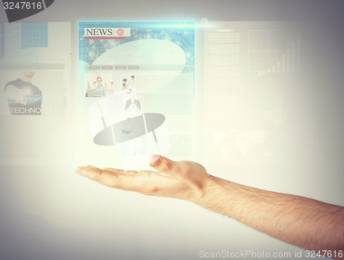 Image of man with virtual screen and news