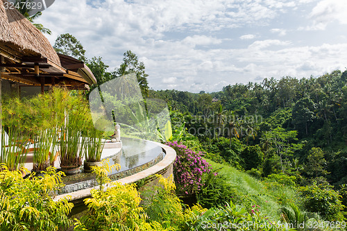 Image of bungalow lounge with swimming pool at hotel resort