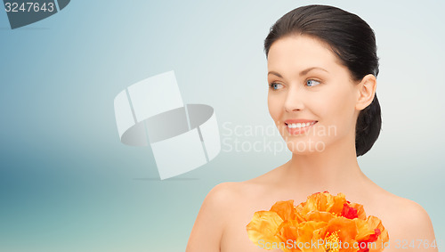 Image of beautiful young woman with flowers