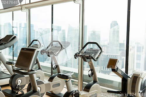 Image of exercise bikes in city gym