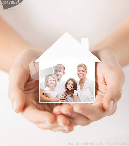 Image of close up of hands holding house shape with family