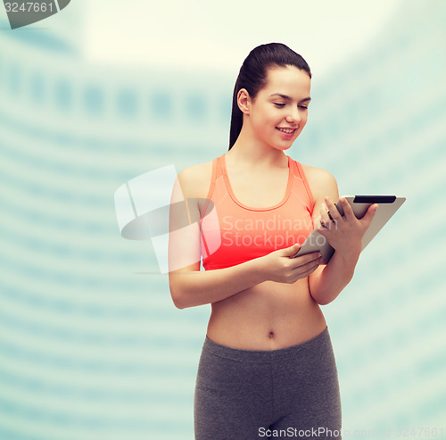 Image of sporty woman with tablet pc computer