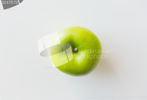 Image of ripe green apple over white