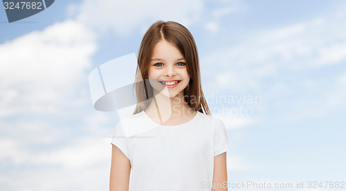 Image of smiling little girl in white blank t-shirt