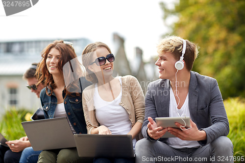 Image of students or teenagers with laptop computers
