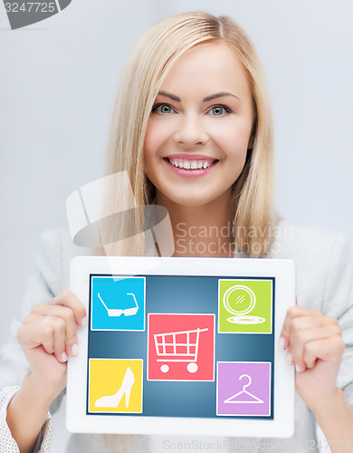 Image of smiling woman showing tablet pc computer screen