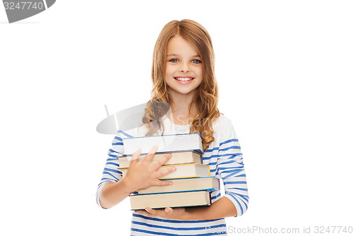 Image of little student girl with many books