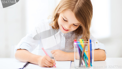 Image of little student girl drawing at school