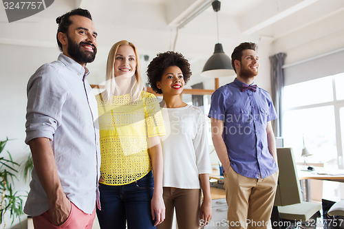 Image of happy creative team in office