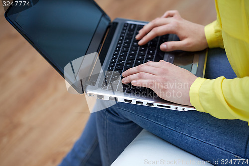Image of close up of woman with laptop computer at home