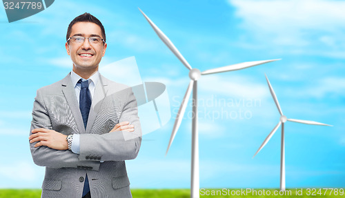 Image of happy smiling businessman in eyeglasses and suit