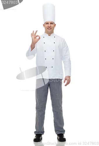 Image of happy male chef cook showing ok sign