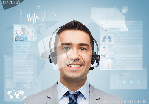 Image of smiling businessman in headset