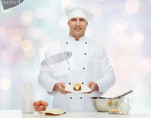 Image of happy male chef cook baking