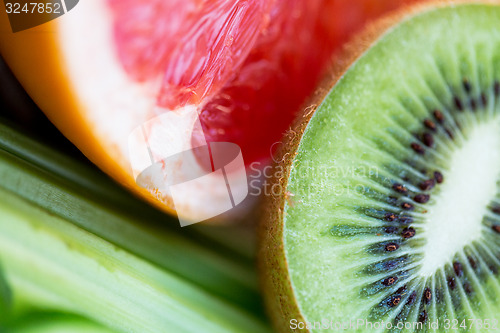 Image of close up of ripe kiwi and grapefruit slices