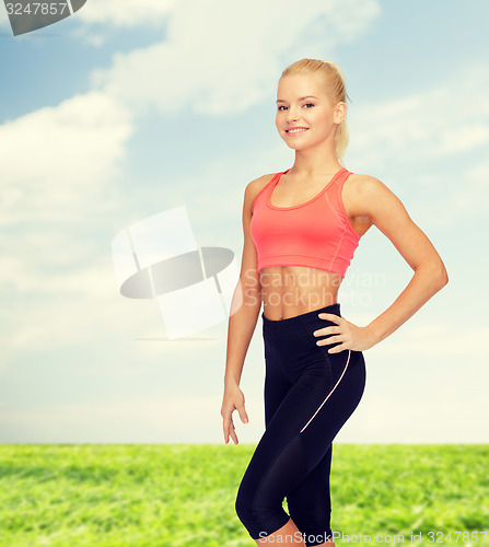 Image of beautiful athletic woman in sportswear