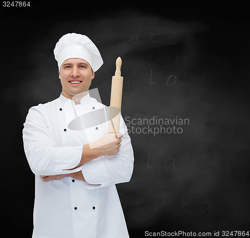 Image of happy male chef cook holding rolling pin