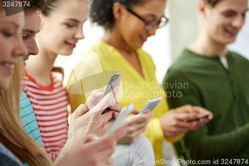 Image of close up of students with smartphones at school