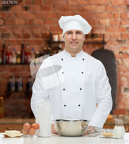 Image of happy male chef cook baking