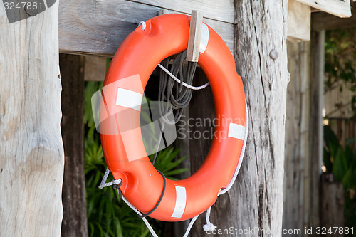 Image of lifebuoy or life preserver hanging on rescue booth