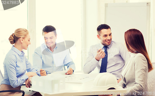 Image of happy team of architects and designers in office