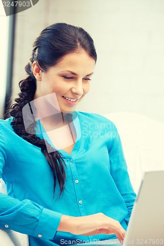 Image of happy woman with laptop computer