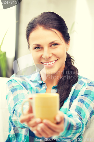 Image of lovely housewife with mug